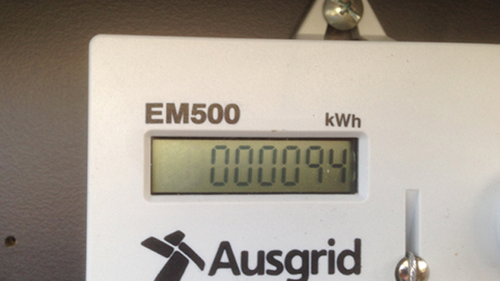 An electricity meter with a digital display.