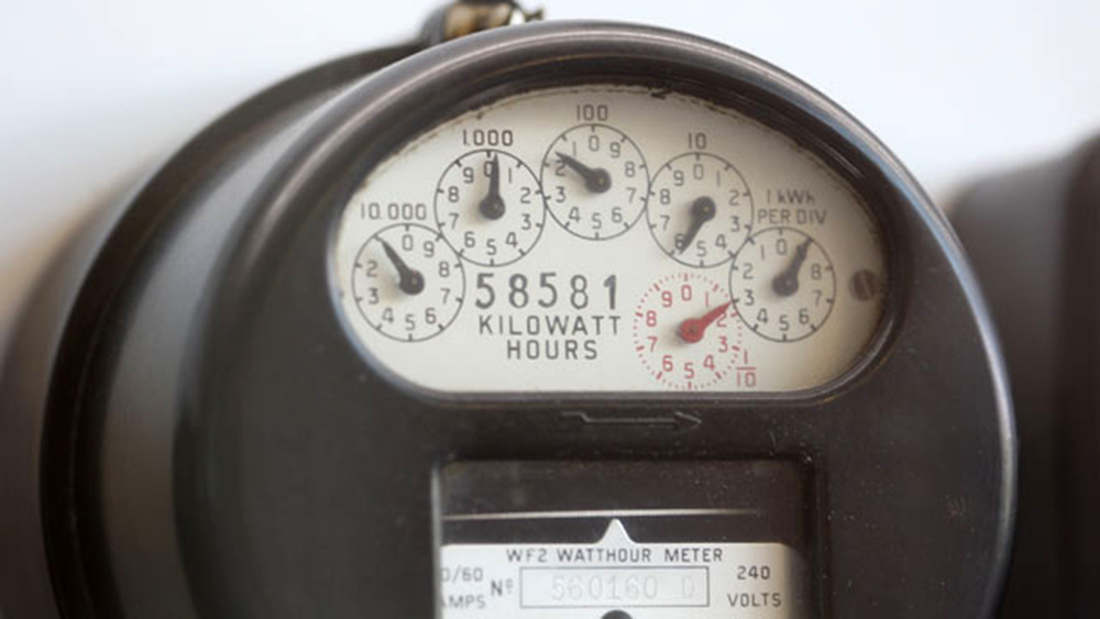 An electricity meter with a dial display.