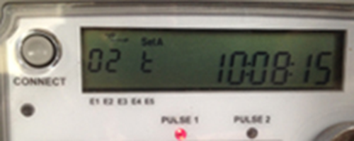 A digital electricity meter displaying the time.